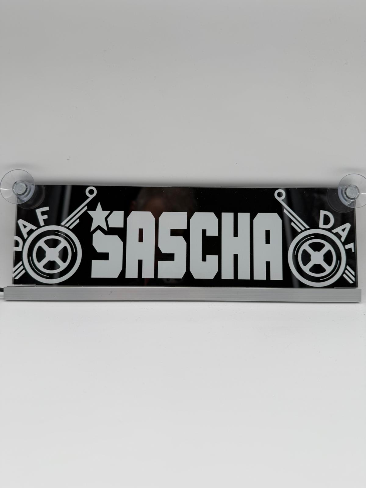 Personalized USB LED name sign with SASCHA, laser engraved for vehicles, mounted with suction cups.