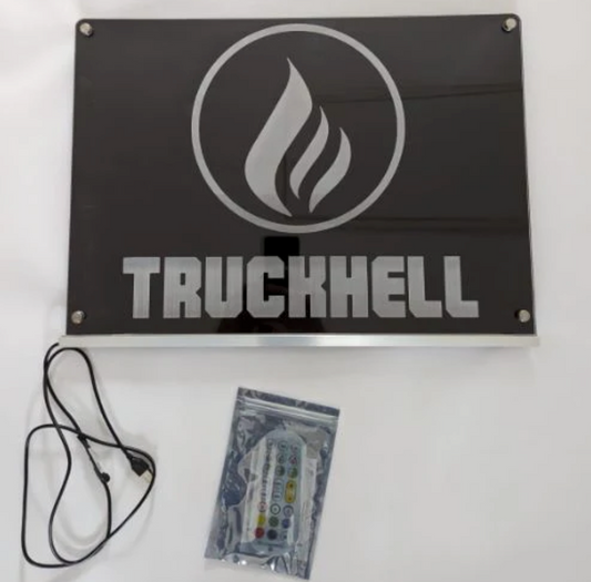 USB LED name sign with 'TRUCKHELL' engraving, flame logo, remote and cable included.